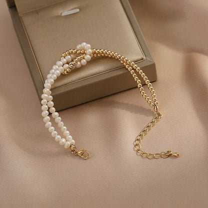 Crossed pearl bracelet